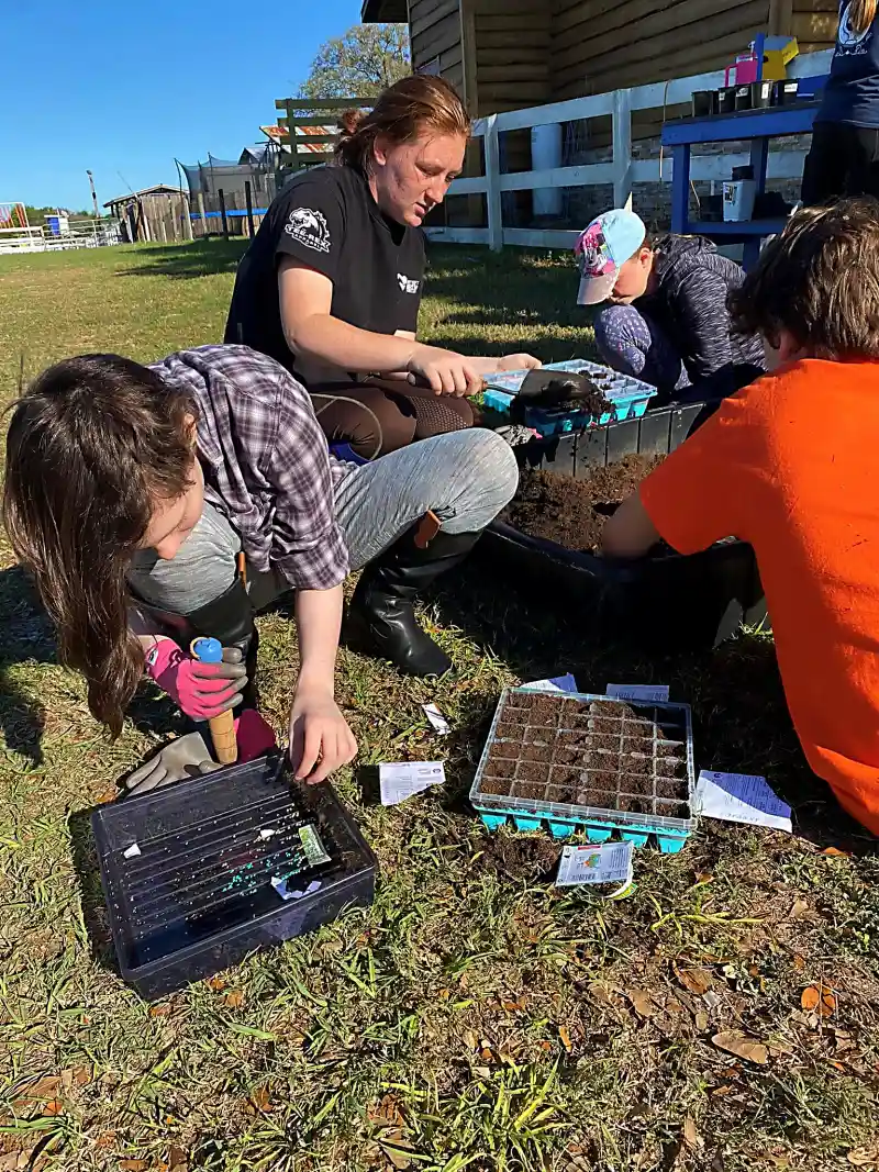 Older students learning stewardship through planting