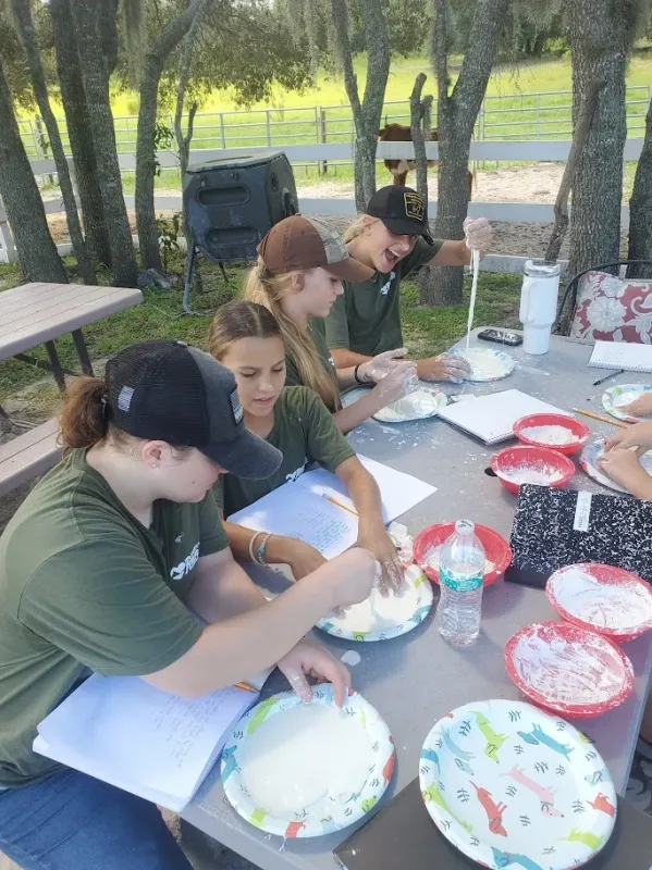 Students participating in outdoor cooking and baking activities