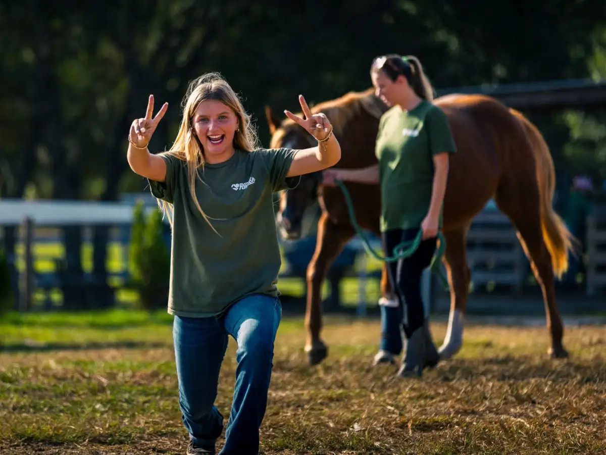 Joyful instructor with horse at Farmstead Living Series
