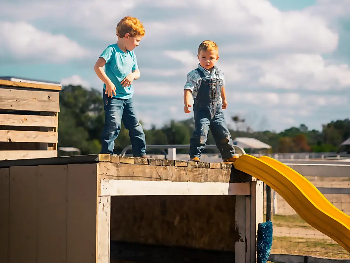 Children playing on farm structure